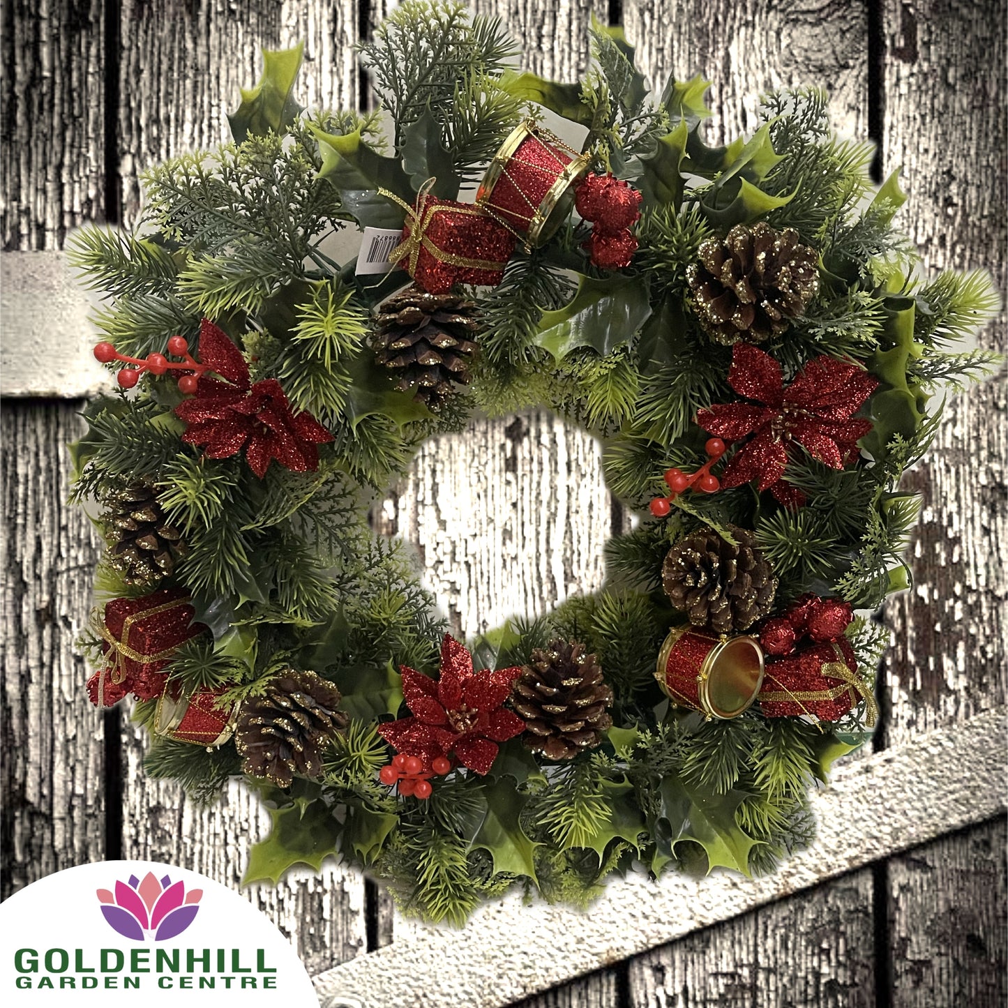 Christmas Wreath With Drums, Poinsettias and Cones. Red